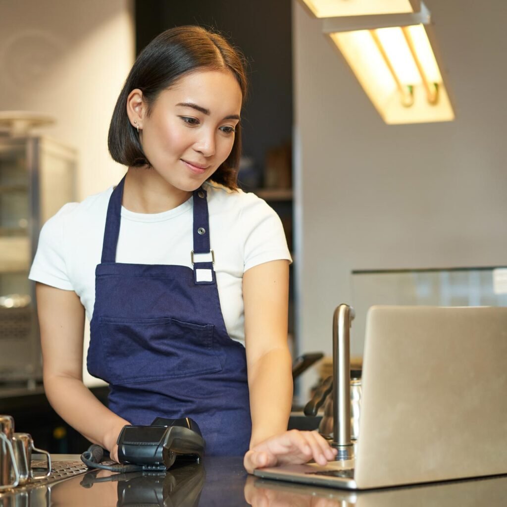 smiling-asian-girl-barista-working-in-cafe-servi-2023-01-11-22-29-44-utc.jpg